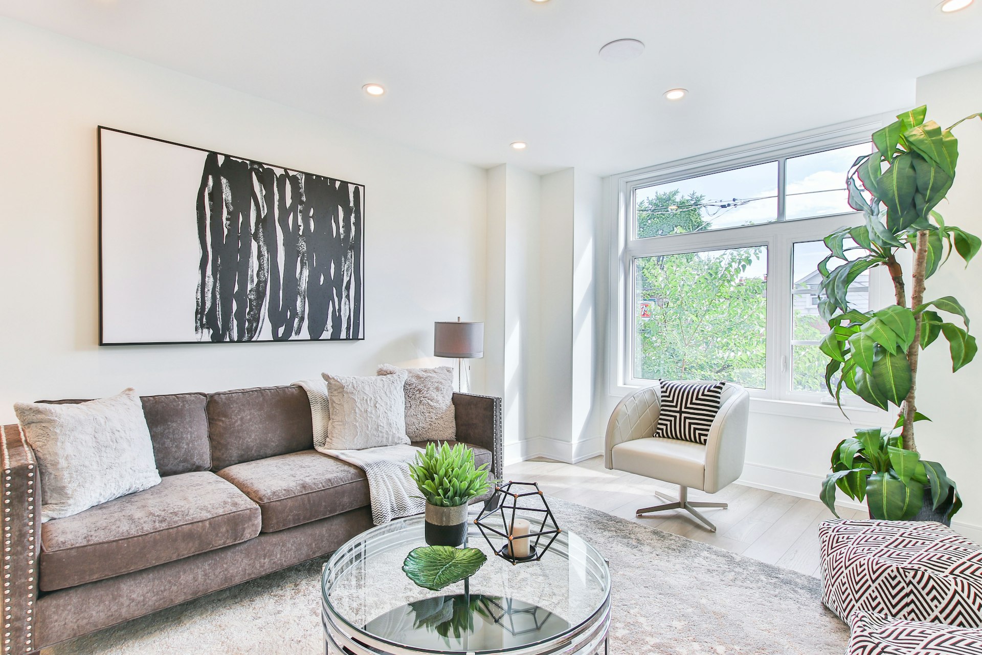 Living room with a warm brown sofa and wood detailing