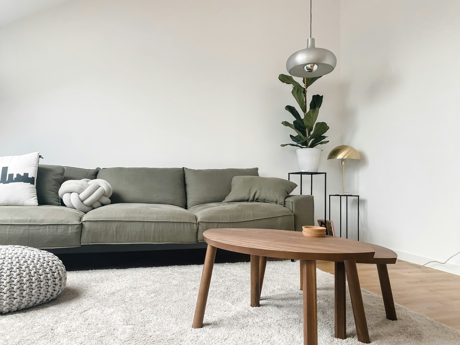 Living room with warm wood furniture and brass accents